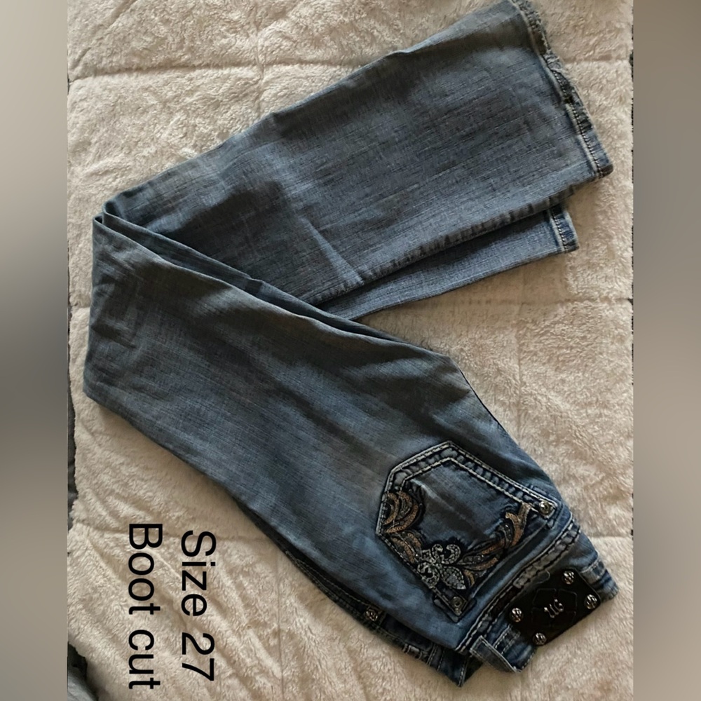 Vintage Miss Me faded denim jeans.
